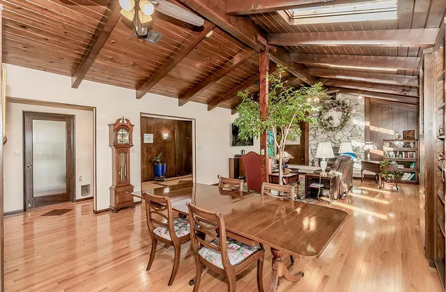 a view of a livingroom with hardwood floor and a ceiling fan