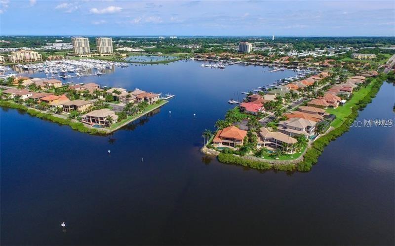 102 Riviera Dunes Way, Unit N30 Palmetto, FL 34221 - Photo 4 of 56 an aerial view of a house with a lake view