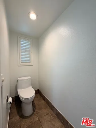 a bathroom with a toilet and a sink
