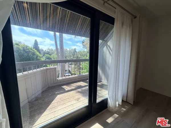 a view of a room with a large window