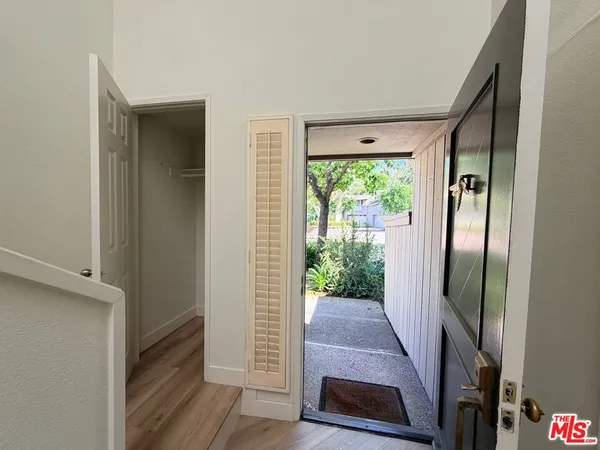 a room with a table and a fireplace