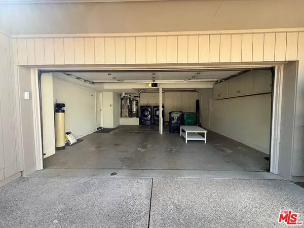 a view of a livingroom with furniture and a ceiling fan