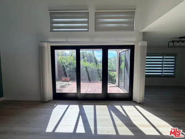 a view of a large window with an outdoor space