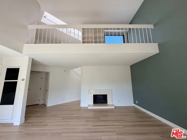 a view of livingroom with furniture and wooden floor