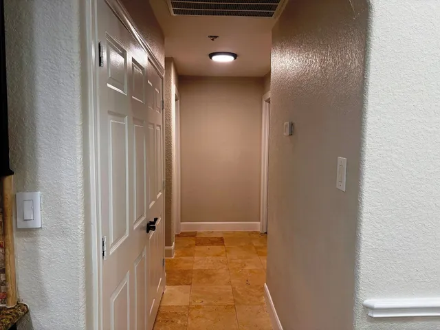 a view of a livingroom and wooden floor