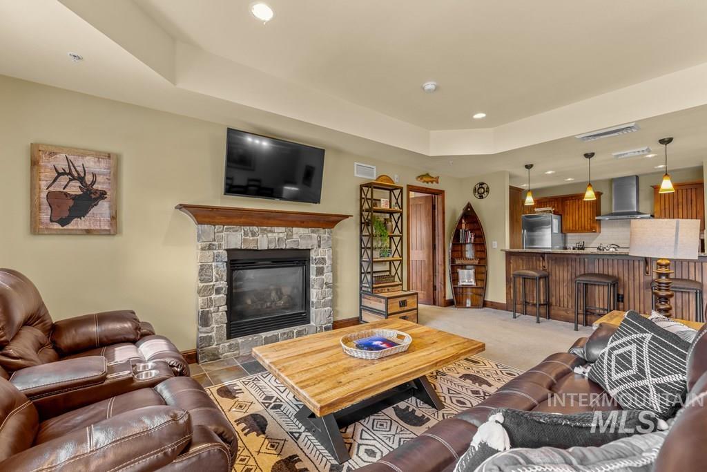 616 North 3rd Street, Unit 304 McCall, ID 83638 - Photo 15 of 38 The great room has a stone, propane fireplace. The rustic furniture is included making it easy to start enjoying your mountain living.