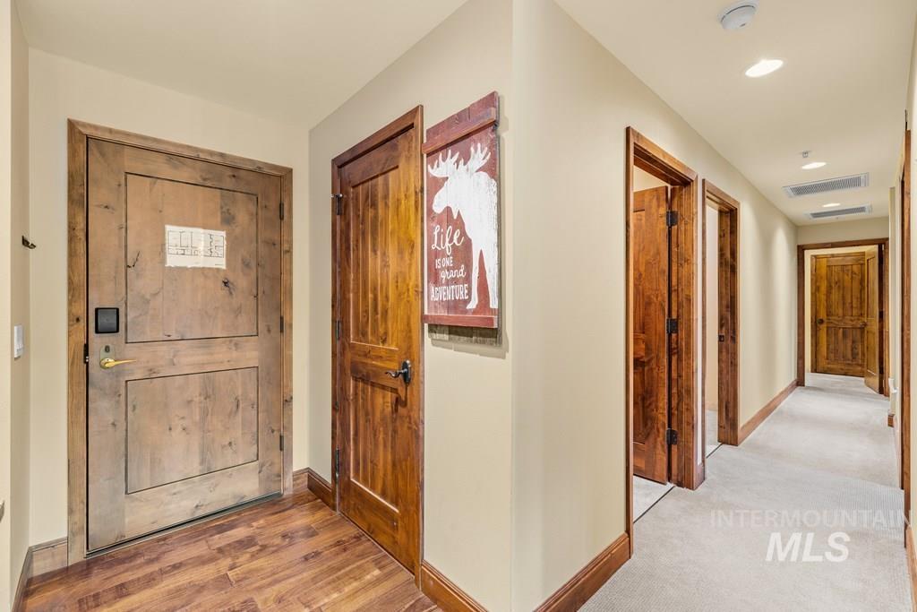616 North 3rd Street, Unit 304 McCall, ID 83638 - Photo 23 of 38 Foyer entrance with baseboards and light wood finished floors