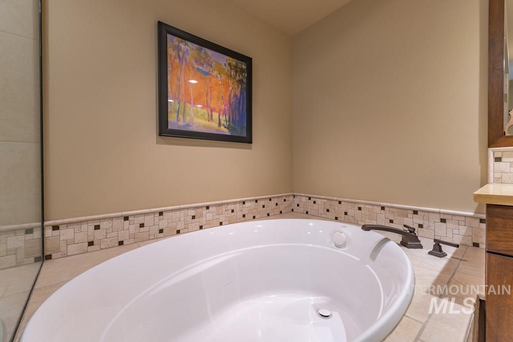616 North 3rd Street, Unit 304 McCall, ID 83638 - Photo 28 of 38 Full bath featuring vanity and a bath