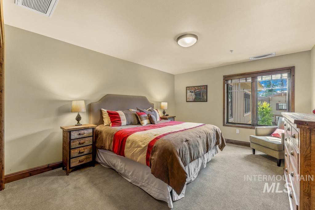 616 North 3rd Street, Unit 304 McCall, ID 83638 - Photo 33 of 38 Bedroom featuring carpet and baseboards
