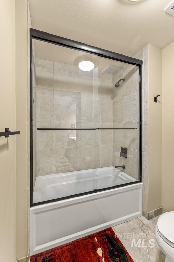 616 North 3rd Street, Unit 304 McCall, ID 83638 - Photo 36 of 38 Full bath featuring toilet and shower / bath combination with glass door