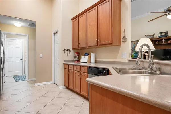 a kitchen with stainless steel appliances granite countertop a sink and a stove