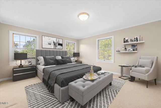 a view of a livingroom with wooden floor and a fireplace