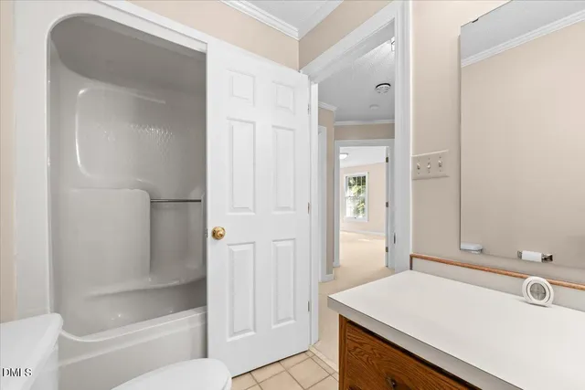 a bathroom with a sink a mirror and a shower