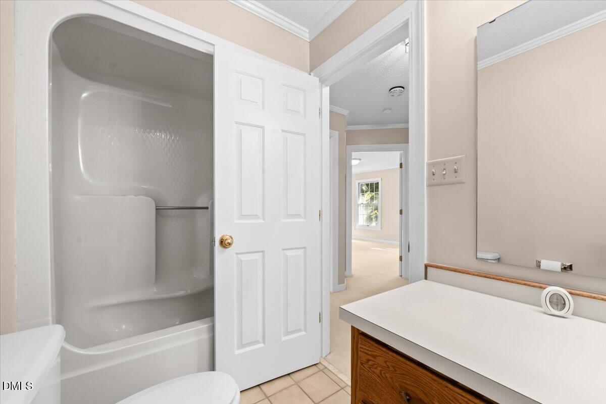 6464 Bonlee Road Bear Creek, NC 27207 - Photo 40 of 82 a bathroom with a sink a toilet and shower