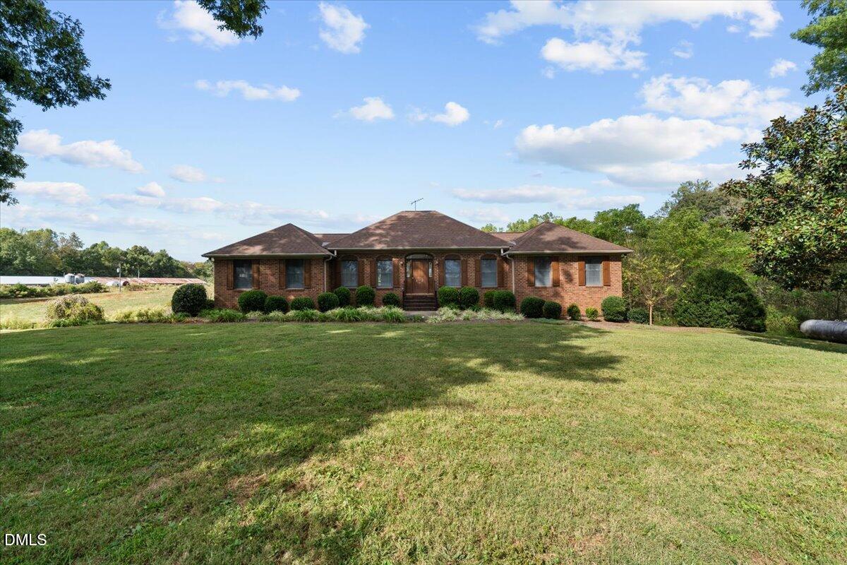 6464 Bonlee Road Bear Creek, NC 27207 - Photo 3 of 82 a front view of a house with a yard