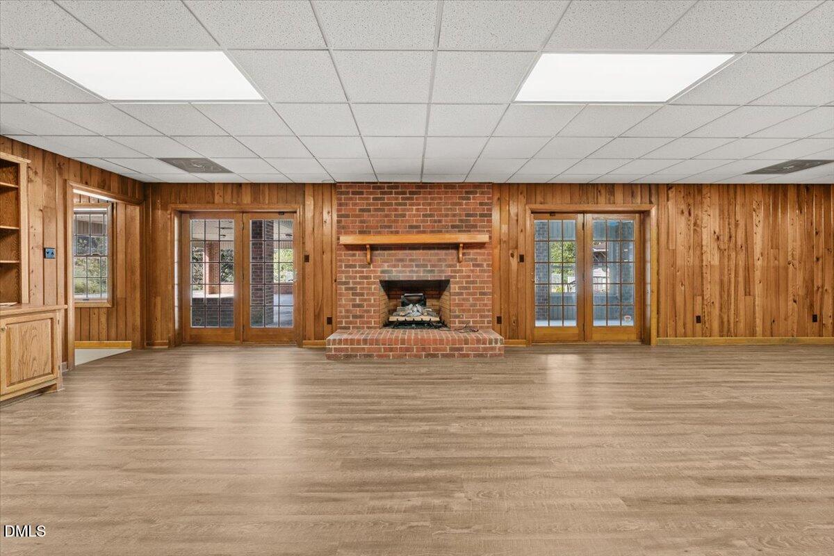 6464 Bonlee Road Bear Creek, NC 27207 - Photo 46 of 82 a view of an empty room with a window and fire place