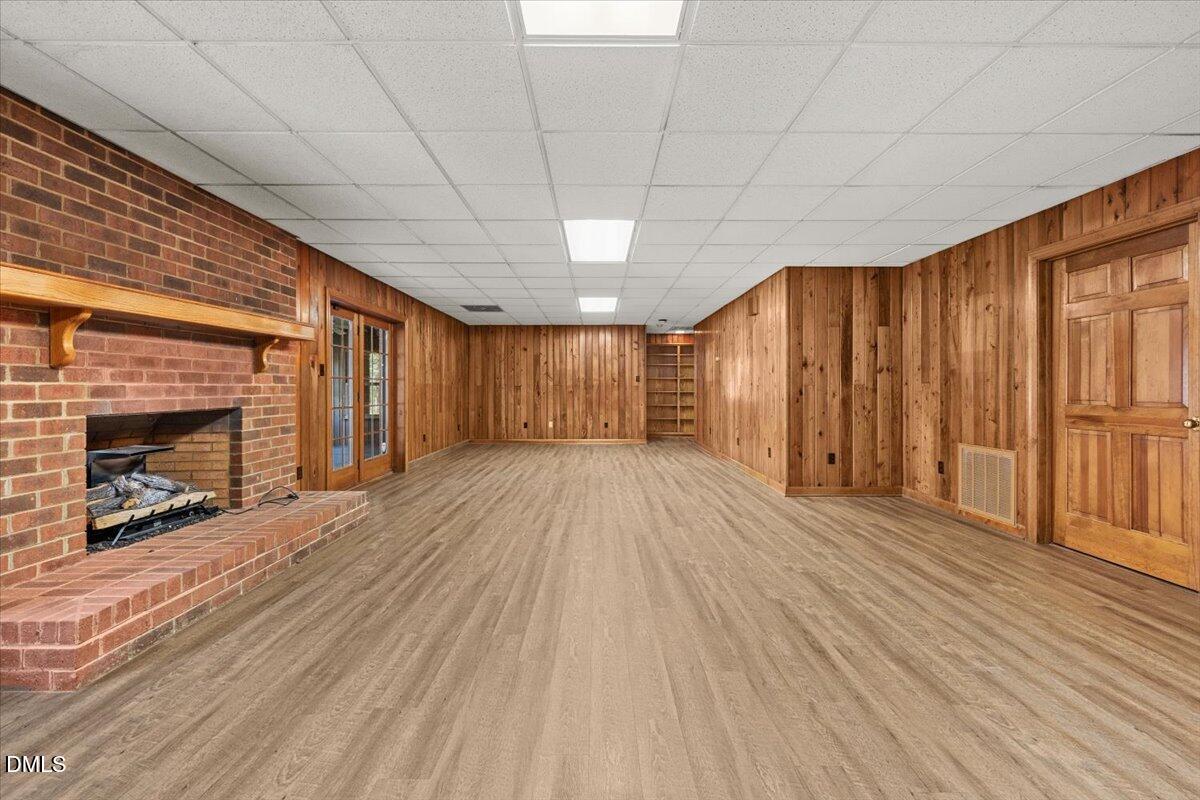 6464 Bonlee Road Bear Creek, NC 27207 - Photo 47 of 82 a view of a livingroom with wooden floor and a fireplace