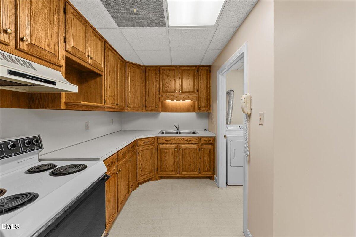 6464 Bonlee Road Bear Creek, NC 27207 - Photo 51 of 82 a kitchen with stainless steel appliances granite countertop a sink stove and cabinets