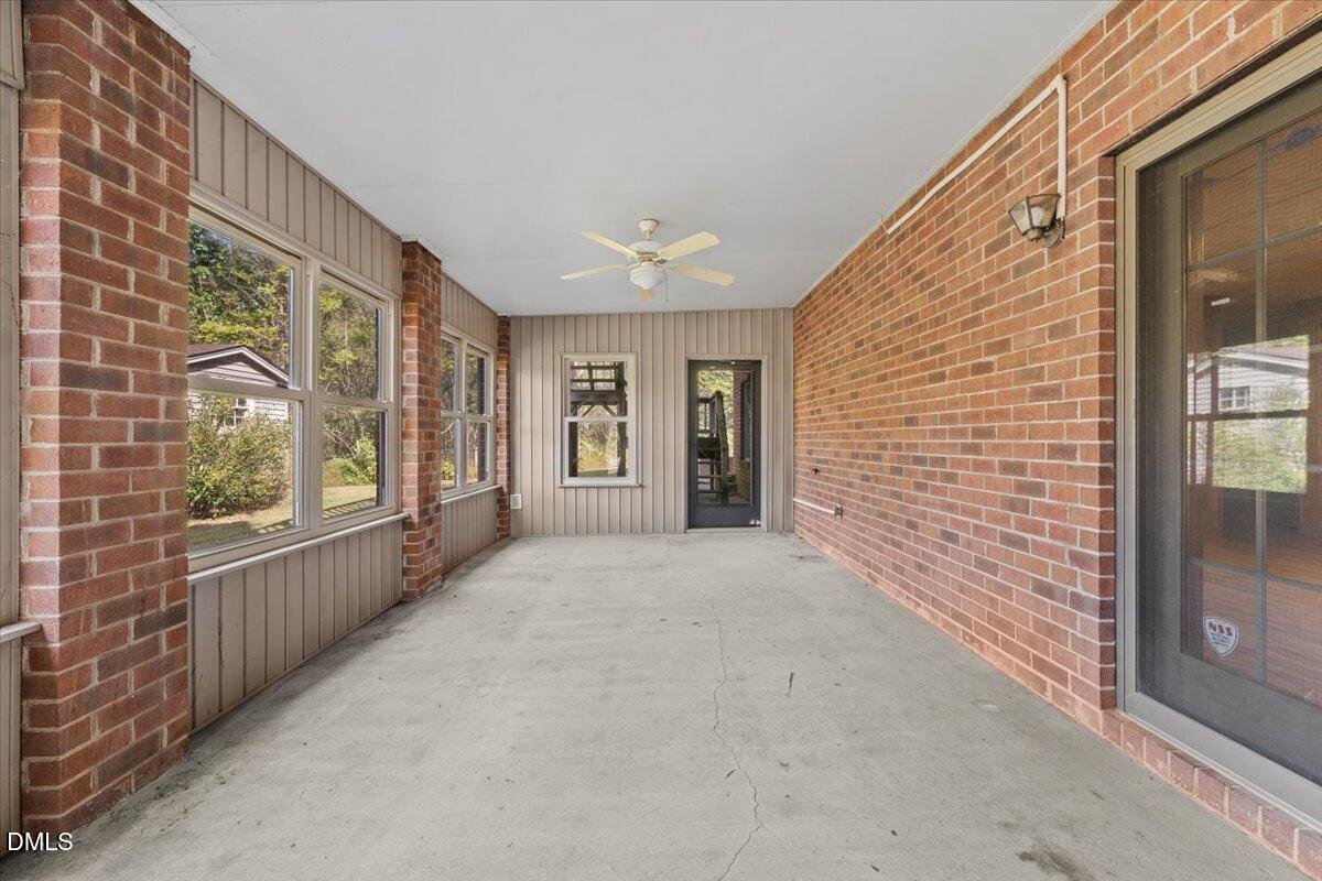 6464 Bonlee Road Bear Creek, NC 27207 - Photo 64 of 82 a view of an entryway with wooden floor and windows