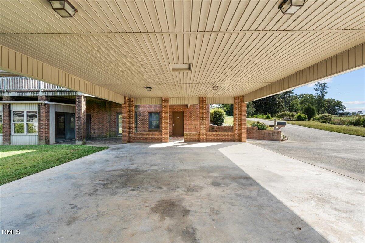 6464 Bonlee Road Bear Creek, NC 27207 - Photo 68 of 82 a view of a patio with table and chairs and potted plants
