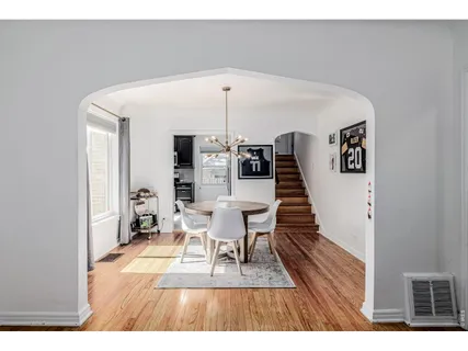 a view of a living room and a wooden floor