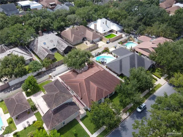 an aerial view of residential houses with outdoor space