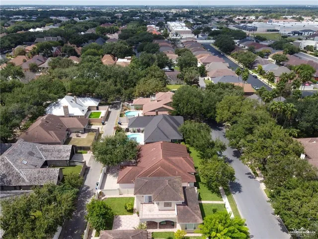 an aerial view of residential houses with outdoor space