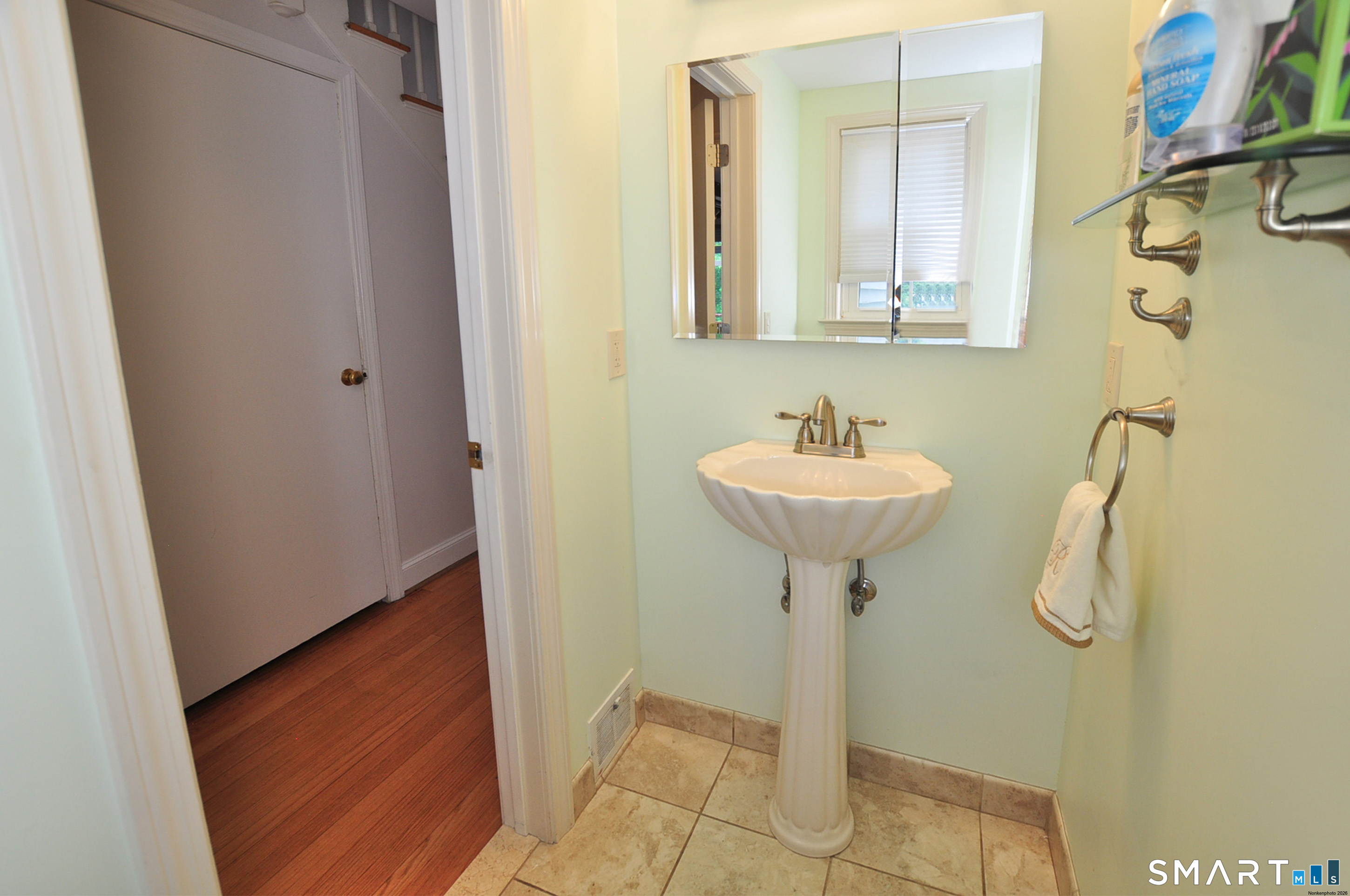 16 Miamis Road West Hartford, CT 06117 - Photo 21 of 39 Half bathroom centrally located on the main floor