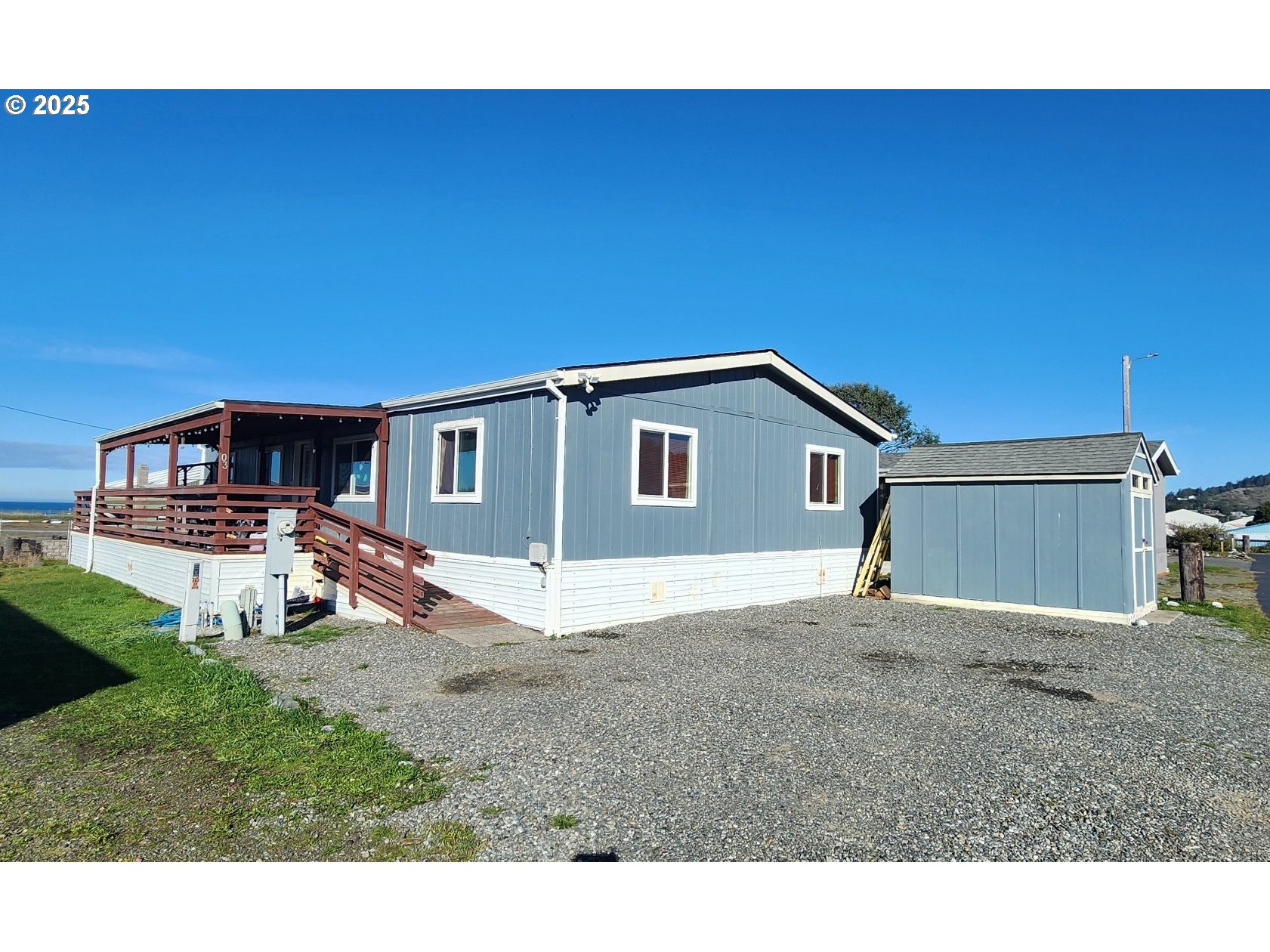 94120 Strahan Street, Unit 3 Gold Beach, OR 97444 - Photo 1 of 20 a house view with a backyard space