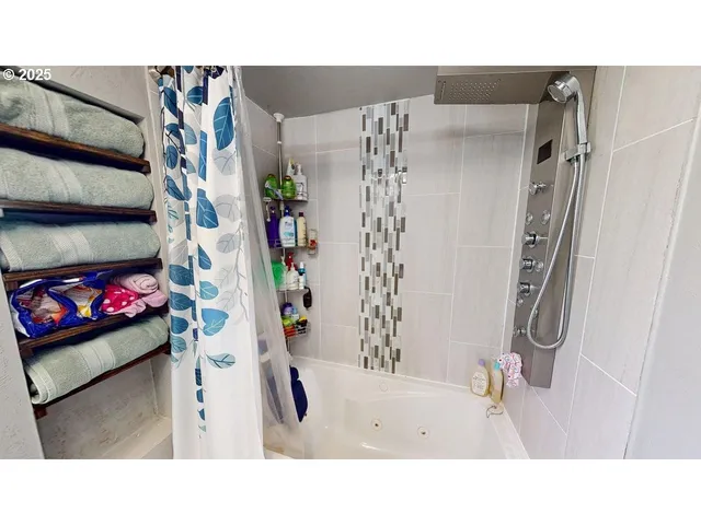 a bathroom with a sink and a shower curtain