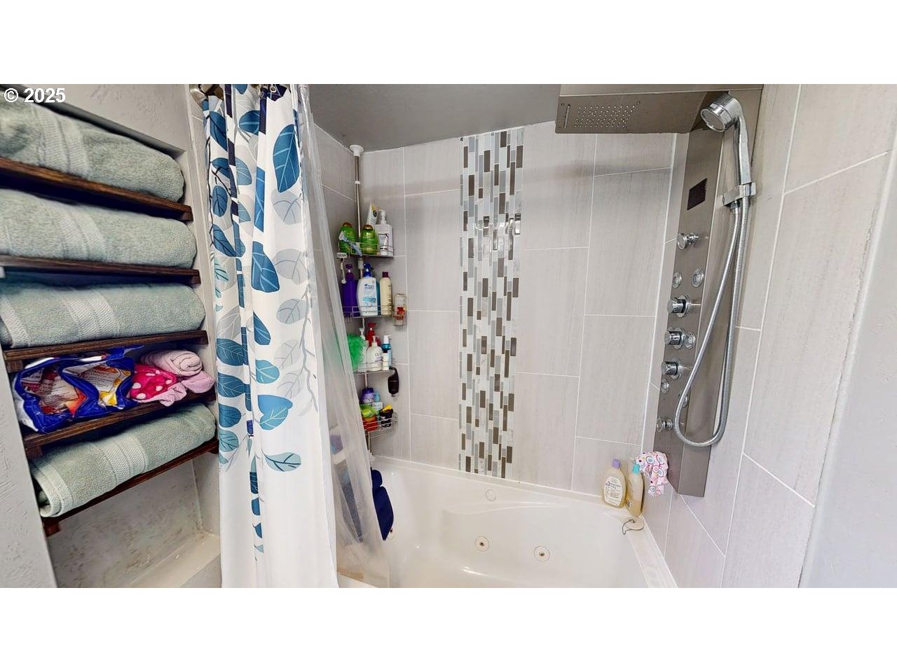 94120 Strahan Street, Unit 3 Gold Beach, OR 97444 - Photo 12 of 20 a bathroom with a sink and a shower curtain