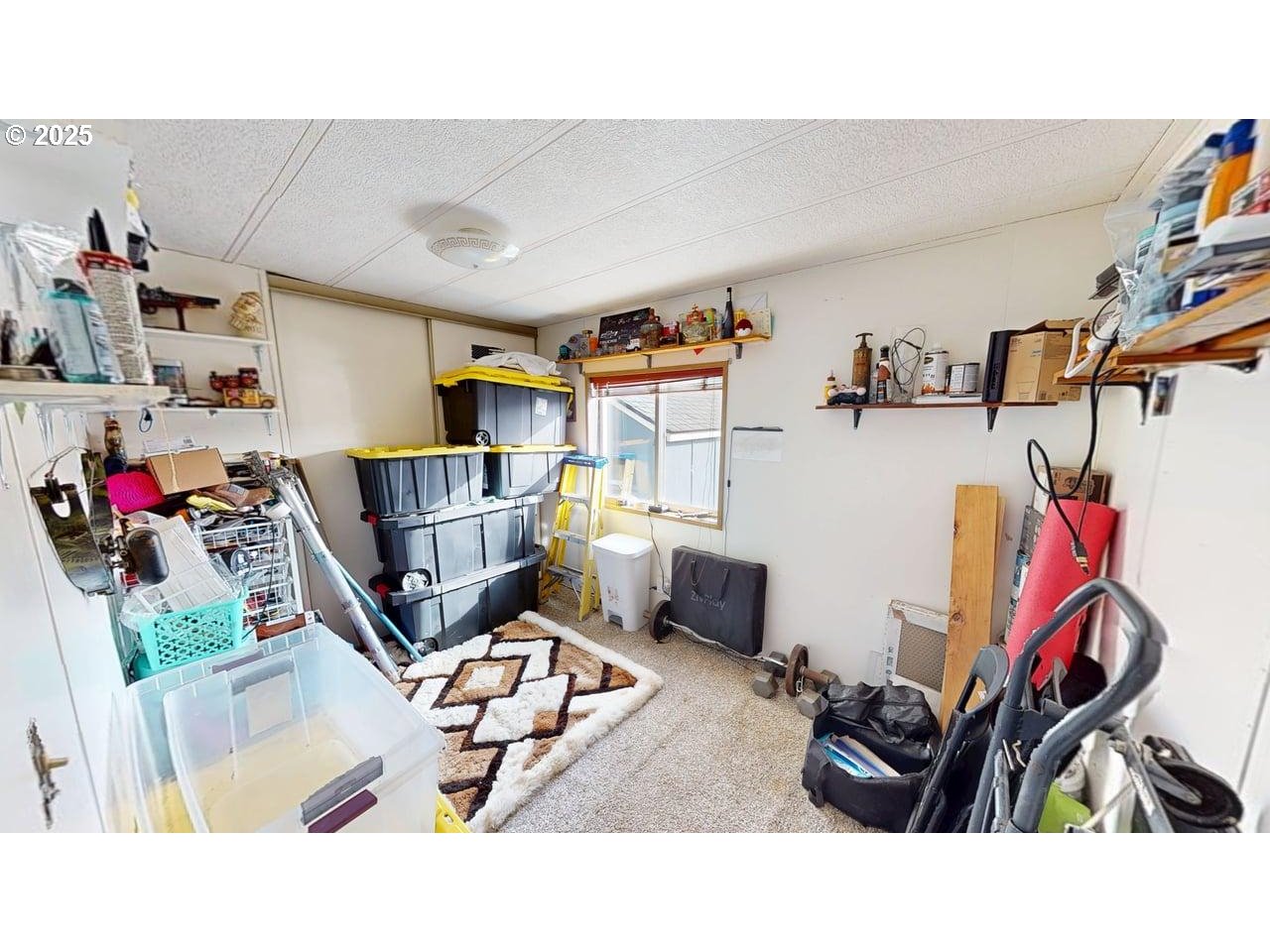 94120 Strahan Street, Unit 3 Gold Beach, OR 97444 - Photo 13 of 20 a living room with furniture and a gym machine