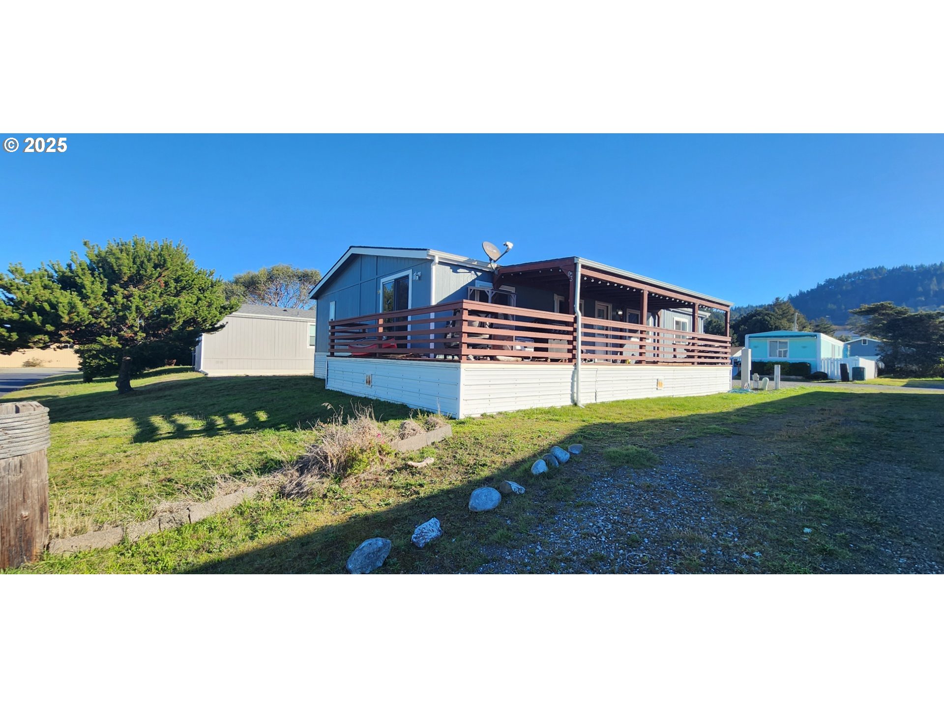 94120 Strahan Street, Unit 3 Gold Beach, OR 97444 - Photo 17 of 20 a view of a backyard with seating area
