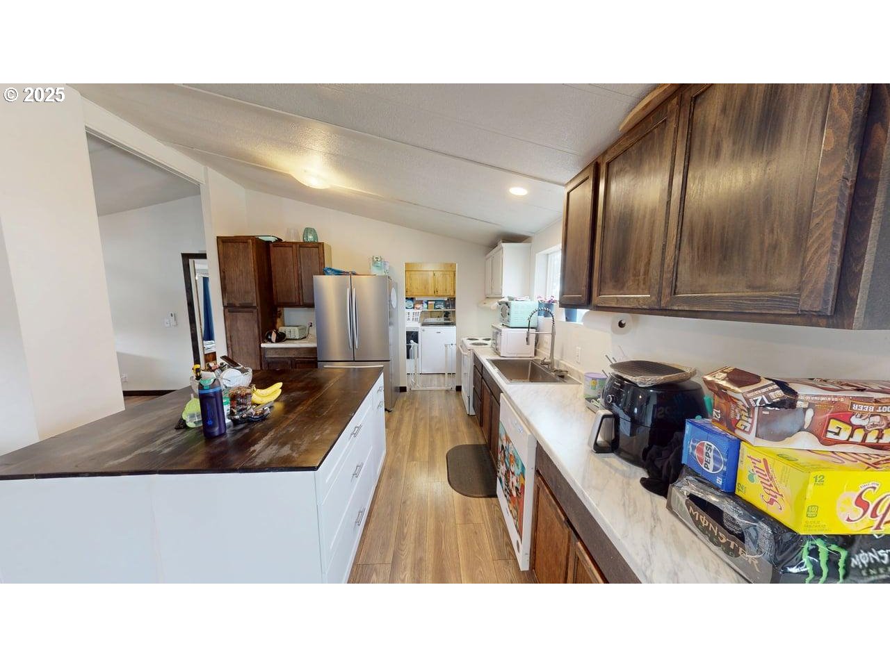 94120 Strahan Street, Unit 3 Gold Beach, OR 97444 - Photo 7 of 20 a kitchen with sink refrigerator stove and microwave