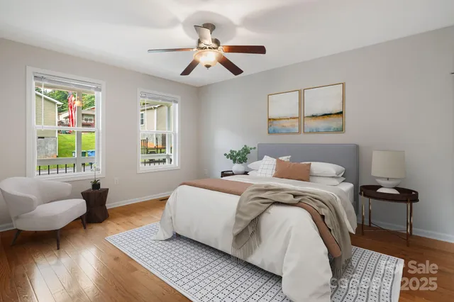 a bedroom with a bed couch and a window