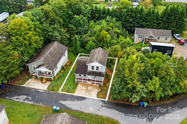 an aerial view of a house with a garden