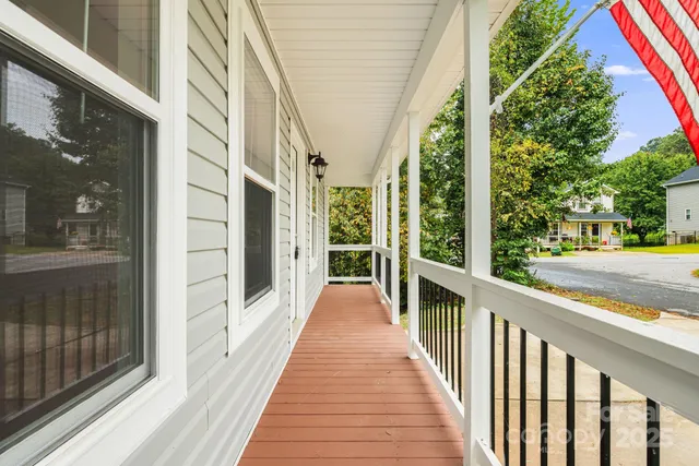 a view of a balcony with chairs