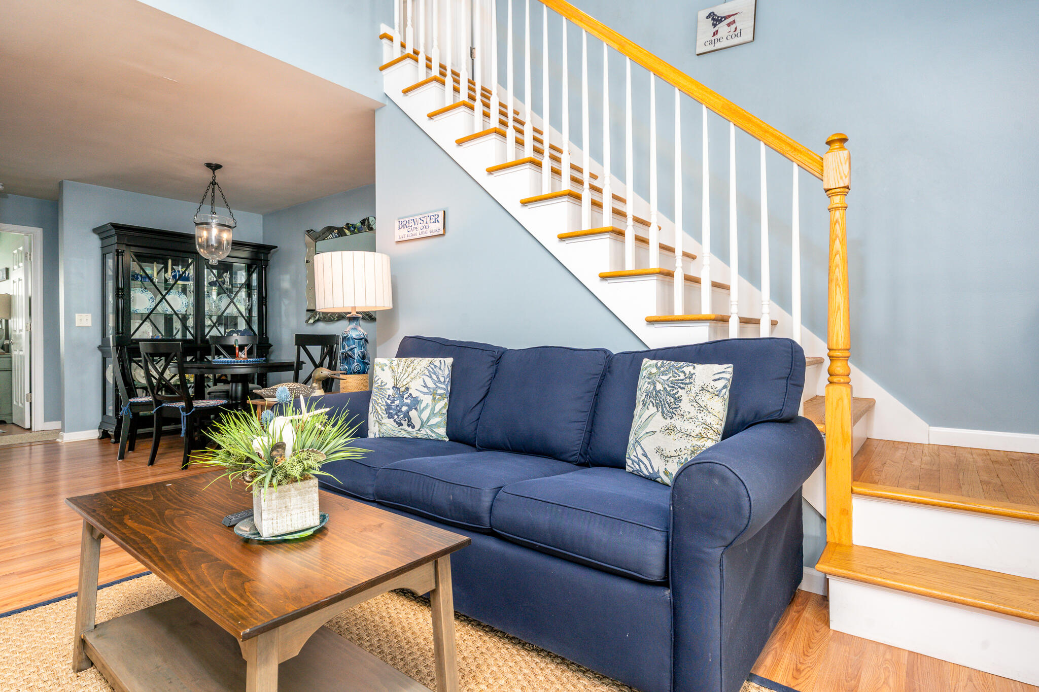 104 Howland Circle, Unit 104 Brewster, MA 02631 - Photo 12 of 29 a living room with furniture and a dining table