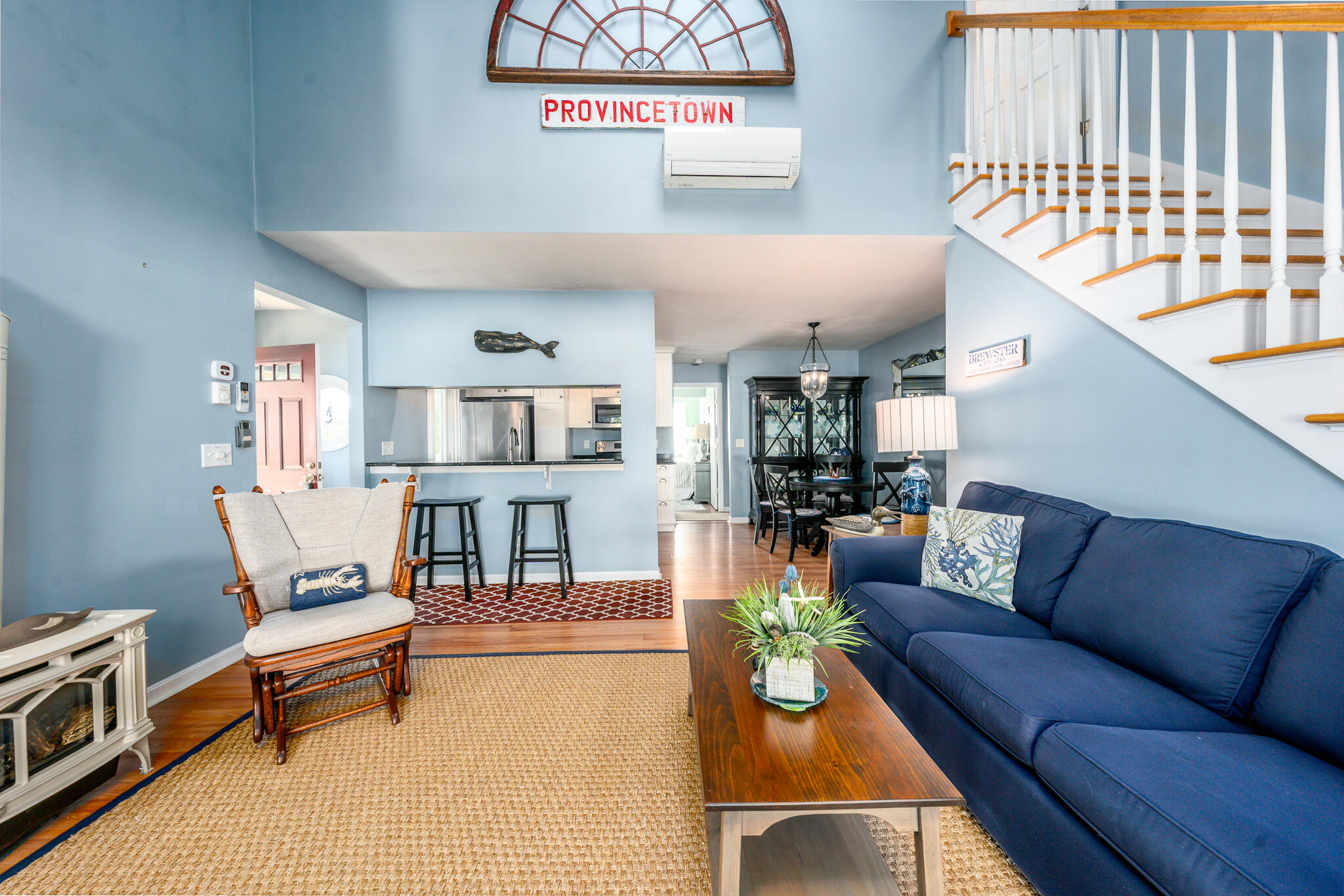 104 Howland Circle, Unit 104 Brewster, MA 02631 - Photo 13 of 29 a living room with furniture and a window