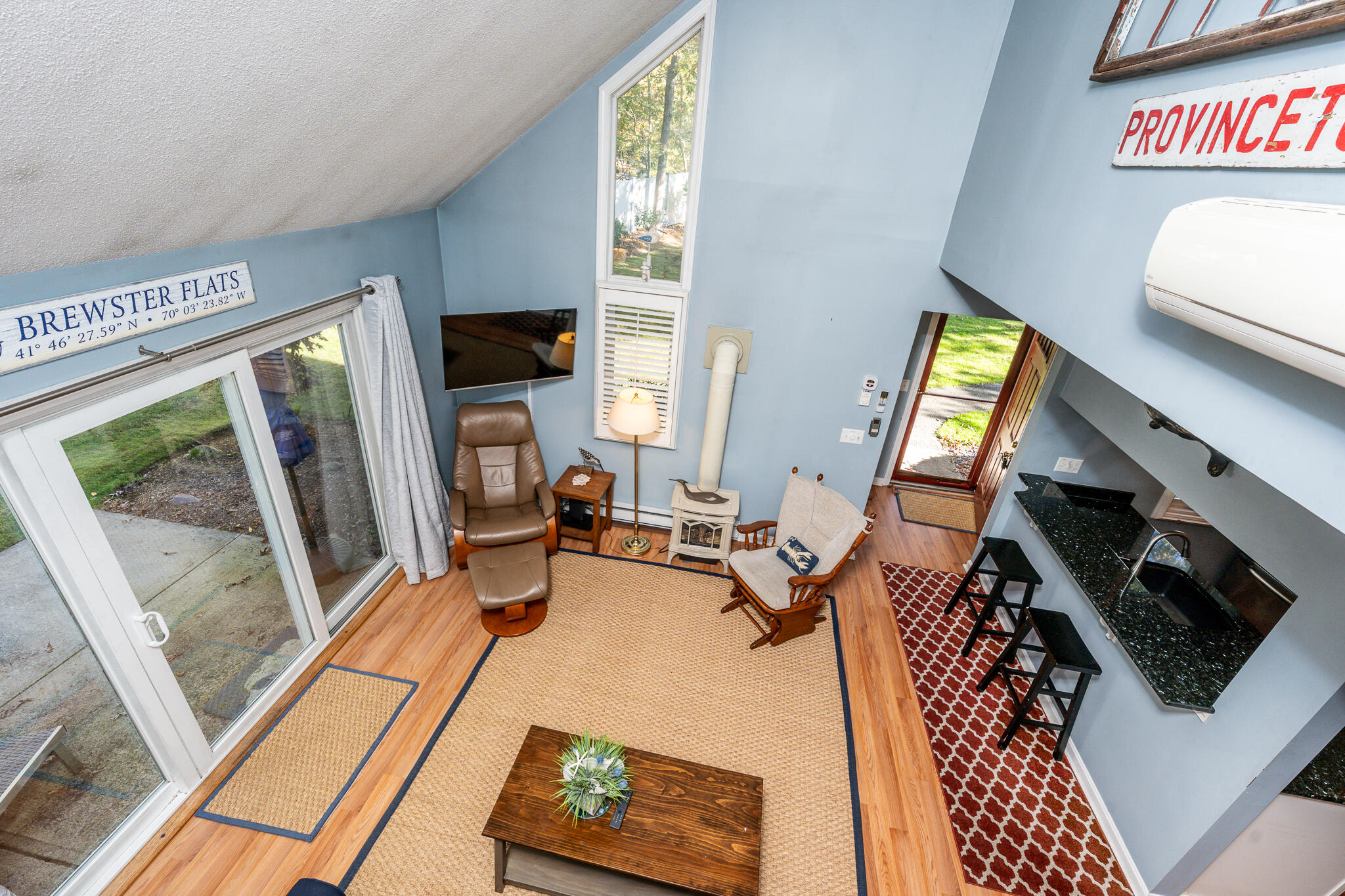 104 Howland Circle, Unit 104 Brewster, MA 02631 - Photo 14 of 29 a living room with furniture and a flat screen tv