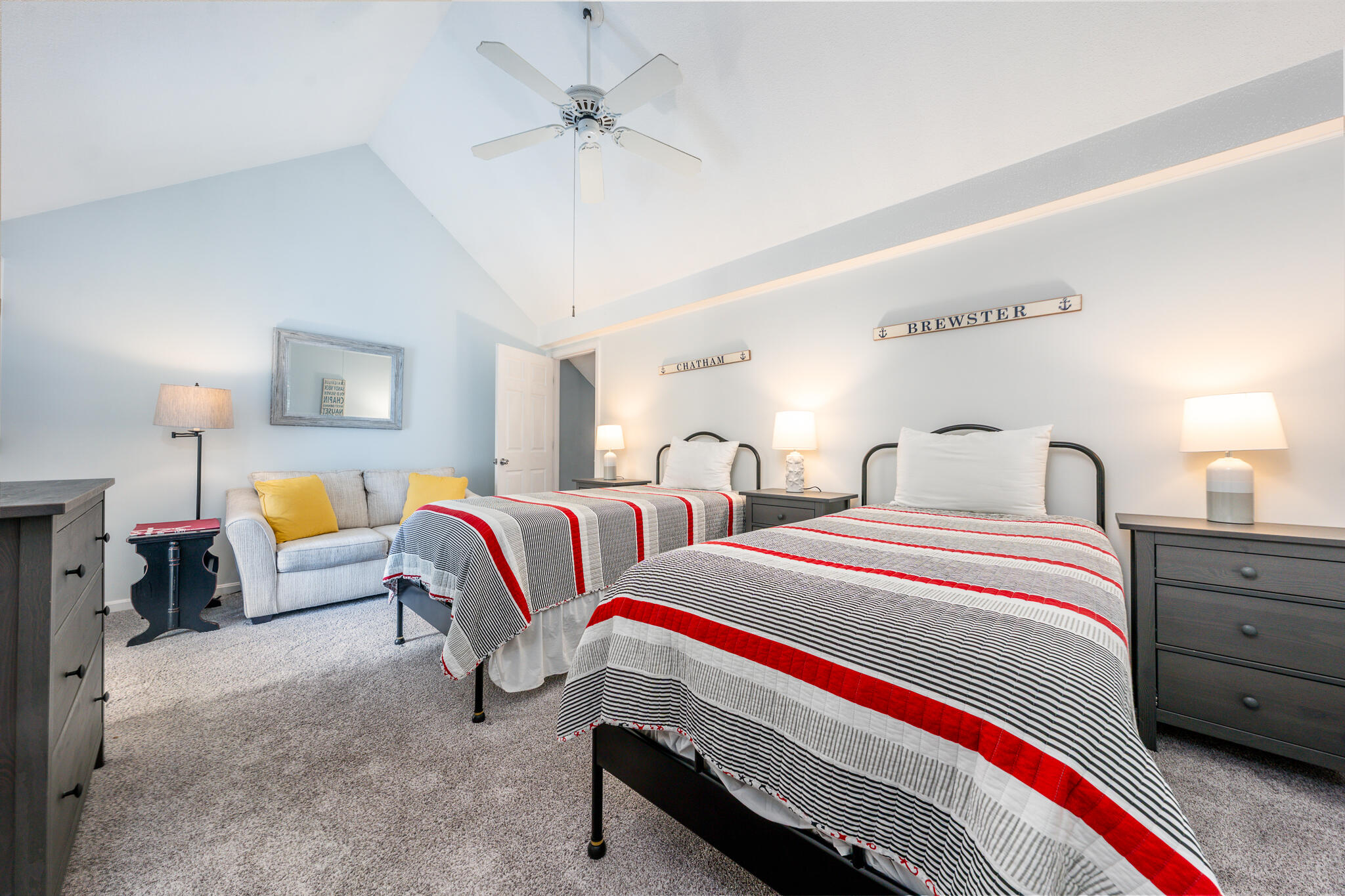 104 Howland Circle, Unit 104 Brewster, MA 02631 - Photo 20 of 29 a bedroom with bed and a chandelier