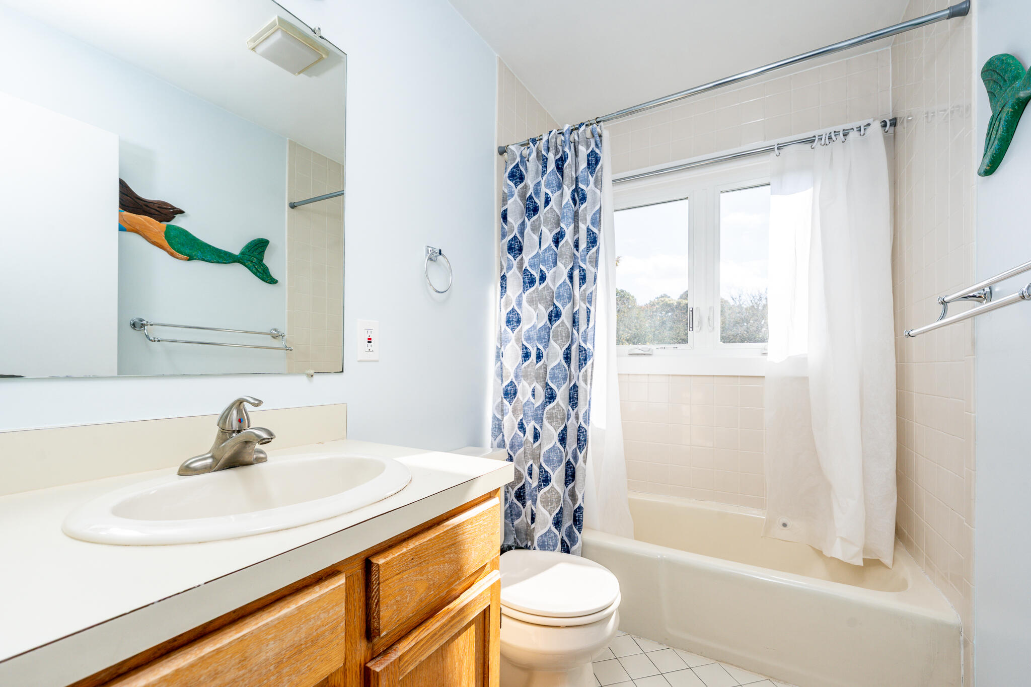 104 Howland Circle, Unit 104 Brewster, MA 02631 - Photo 21 of 29 a bathroom with a sink a toilet and shower