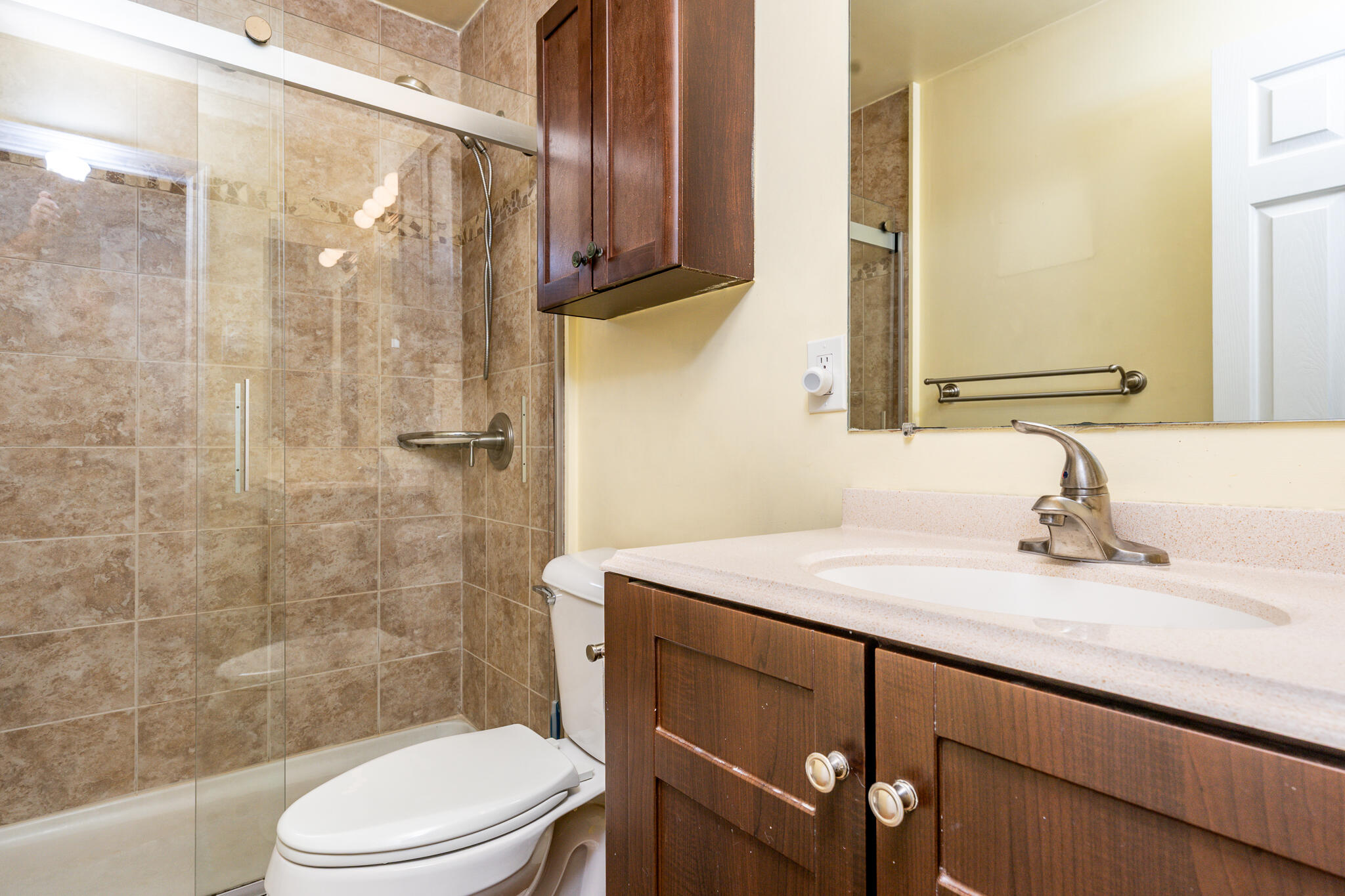 104 Howland Circle, Unit 104 Brewster, MA 02631 - Photo 22 of 29 a bathroom with a sink a toilet and shower