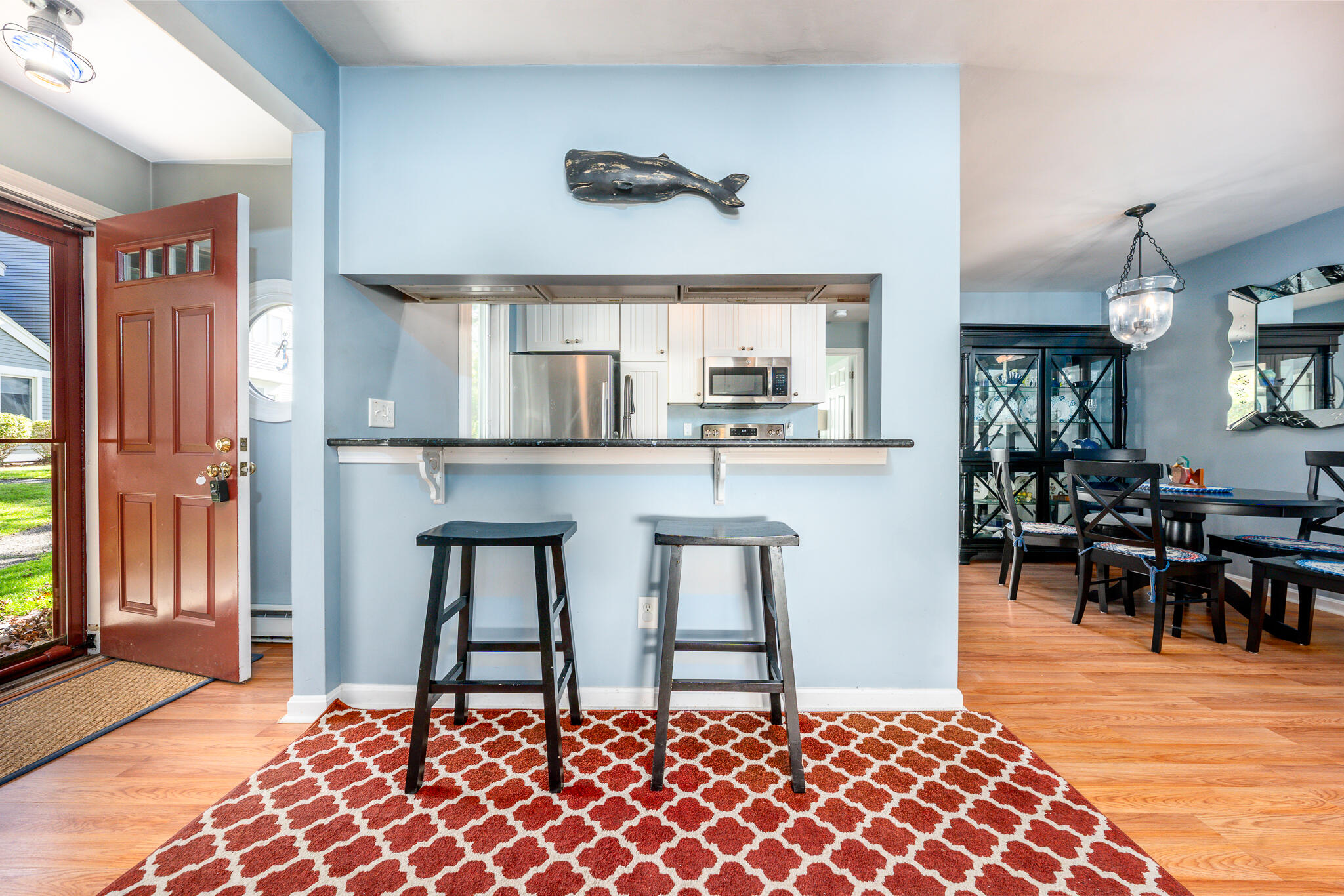 104 Howland Circle, Unit 104 Brewster, MA 02631 - Photo 5 of 29 a living room with stainless steel appliances kitchen island granite countertop furniture and a rug
