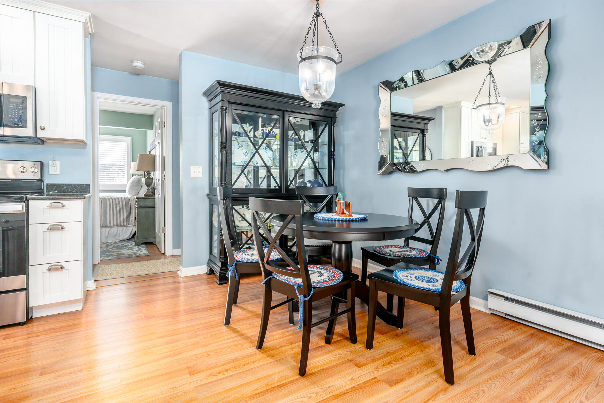 104 Howland Circle, Unit 104 Brewster, MA 02631 - Photo 8 of 29 a view of a dining room with furniture and wooden floor