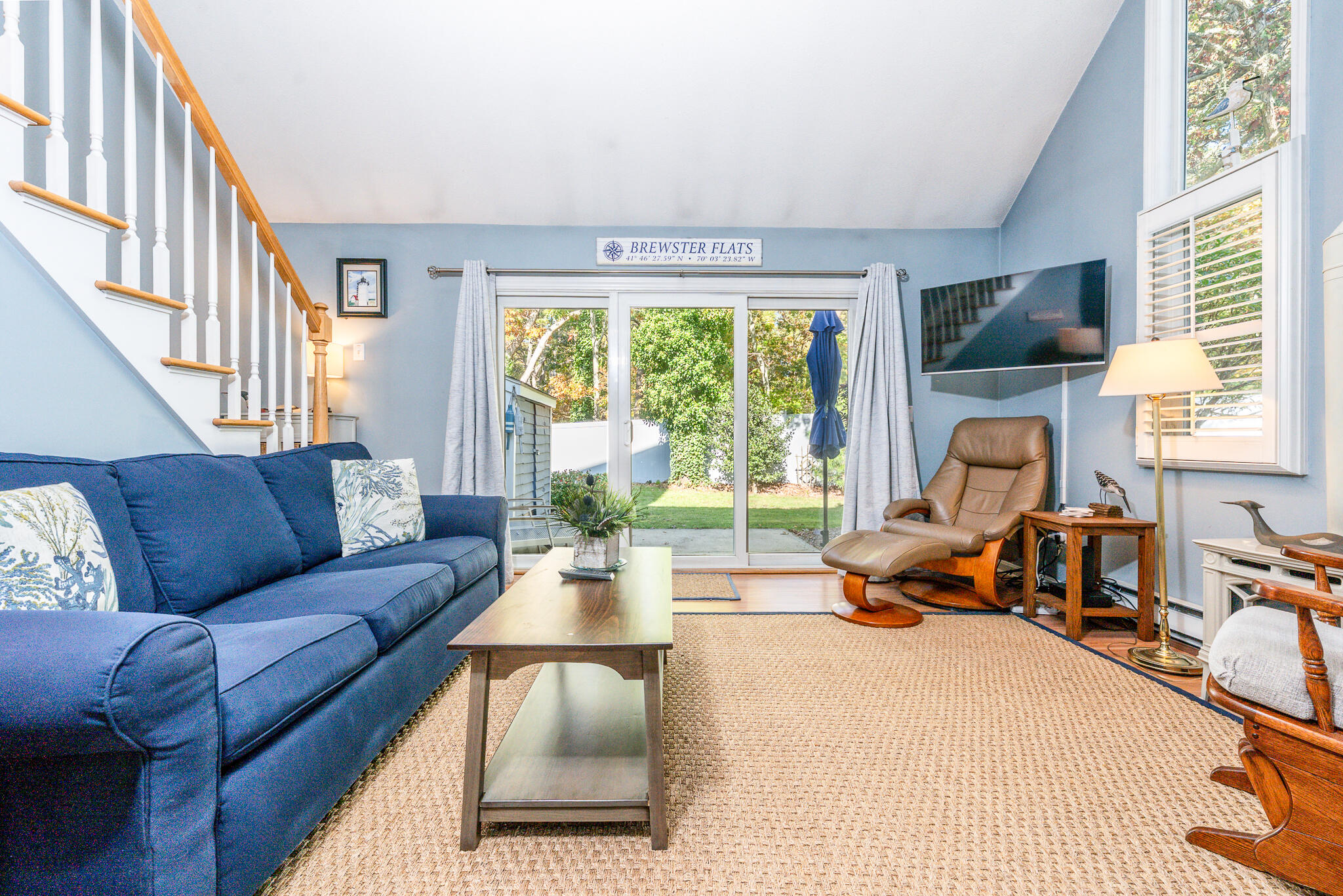 104 Howland Circle, Unit 104 Brewster, MA 02631 - Photo 9 of 29 a living room with furniture and a large window