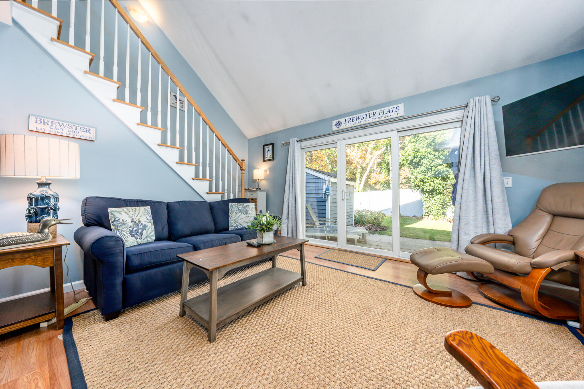 104 Howland Circle, Unit 104 Brewster, MA 02631 - Photo 10 of 29 a living room with furniture and a large window