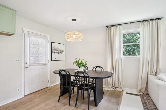 a bathroom with a white bath tub and a shower