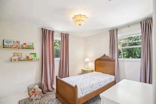 a living room with furniture and walk in closet