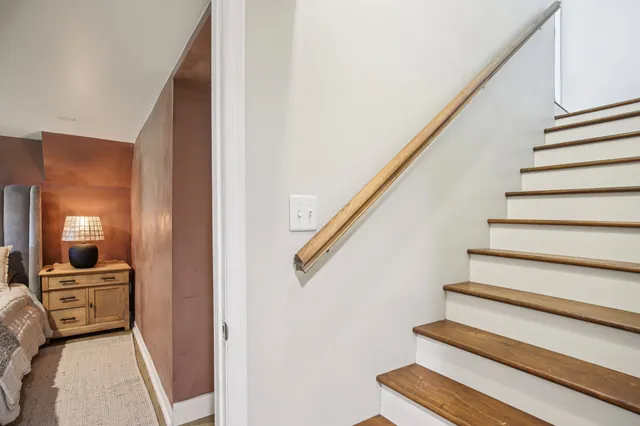 a view of a porch with furniture and garden